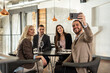 © Creative Light - Group of friends taking a selfie at a restaurant during a social gathering