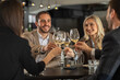 © Creative Light - Friends toasting with wine glasses at a restaurant