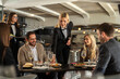 © Creative Light - Elegant restaurant scene with server serving food to happy customers at a table