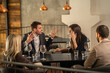 © Creative Light - Group of people having a heated argument at a restaurant table