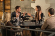 © Creative Light - People arguing at a restaurant table, expressing frustration and disagreement