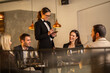 © Creative Light - Waitress taking an order from a group of friends at a restaurant
