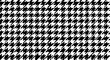 © Suryani - A classic black and white houndstooth pattern, a timeless textile design.