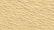 © Servo Graphics - Close-up textured surface of golden sand with subtle wave patterns
