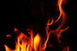 © dimas830 - Vibrant flames dancing against a dark background, creating a fiery spectacle