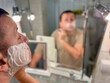 © Marina Chernivetskay - Man shaving in bathroom mirror