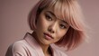© Никита Цыганков - Editorial style close-up portrait of a beautiful young Asian woman with trendy pink bob haircut and soft makeup, looking subtly at the camera.