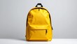 © Studio - Bright yellow backpack with black zipper and handle, standing upright on a white surface against a light gray background.