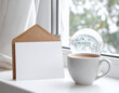 © Marvellino - Cozy Winter Scene Blank Card and Coffee Cup on a Snowy Window Sill - Invitation or Message Concept