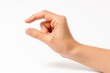 © Artcuboy - Neutral hand making a gentle pinch pose as if holding a thin card minimal isolated gesture for app ui and product preview