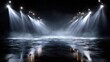 © Chotijah - Stage lights illuminate a wet, reflective floor in the darkness.
