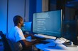 © Serhii - Portrait of african american male programmer in office at night