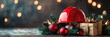 © syhin_stas - Orange construction helmet and Christmas ornaments decorating a wooden table with a pine tree, celebrating the holiday season amidst a bokeh of festive lights. Banner, copy space