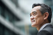 © Enrique - Side profile portrait of a business asianman, 50 years old, office background with copyspace