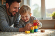 © Vadym - Happy father, son play together with colorful wooden blocks on floor at home. Young dad, little boy child build tower smiling, enjoy bonding time. Family fun, learning, creative activity indoors.
