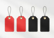© Hasanur Rayhan - Four rectangular hang tags one red two black with metal loops attached for display