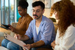 © alvaro - Diverse business team collaborating during an informal meeting - Financial, insurance and legal advisory