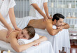 © InfiniteFlow - Caucasian couple customer enjoying relaxing anti-stress spa massage and pampering with beauty skin recreation leisure in day light ambient salon spa at luxury resort or hotel. Quiescent