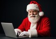 © 5 Grace Media - Portrait of Santa Claus smiling warmly while using a laptop against a dark background