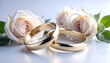 © Joko - Golden wedding rings with white roses. Luxury gold bands romantic wedding scene. Elegant marriage rings with soft roses. Classic gold rings bridal floral concept