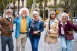 © alvaro - Group of senior friends enjoying urban travel experience
