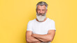 © iPhoto - Stock photo of senior man with beard isolated on yellow background shot