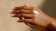 © piai - Woman’s hand applying cream on back of other hand, soft golden hour light, skincare application detail, commercial beauty shot