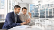 © fizkes - Confident young business partners working on online project solutions together