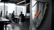 © photo for everything - Metal shield with orange checkmark signifies a secure environment. Modern office background with blurred figures adds a professional touch. Security and safety in business.