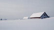 © photo for everything - A serene winter scene showcases a snow-covered field leading to quaint barns under a muted sky, evoking a sense of peace and isolation in the minimalist landscape.