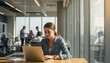 © Vhagar - Contemporary workspace with city skyline views and professionals engaged in teamwork under natural sunset lighting