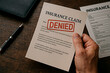 © Creative mind - Insurance claim denial: concept of refusal or rejection.