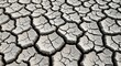 © Rikhy - Abstract background of a barren and cracked land surface showing the effects of severe drought and environmental concerns