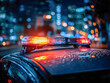 © SvoP - Illuminated emergency lights flashing on top of police vehicle reflecting city nightscape with vibrant bokeh streetlights in urban environment