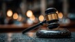 © Liudmyla - Wooden gavel and sounding block on dark blurred background symbolizing justice