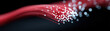 © Nakarin - Glowing red fiber optic cables with bright light points on dark background showing fast data transmission concept