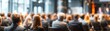 © Thamonchanok - Blurred audience attending professional business conference concept. Blurry image of attendees engaging in a corporate conference.