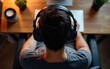 © li - Man In Headphones Working From Home, Top View. High quality