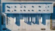 © SUYATI - Trucks lined up at a modern distribution center, ready for efficient deliveries, showcasing logistics and supply chain management from above