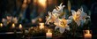© Thamonchanok - White lilies and candle at funeral sunset concept. Peaceful scene with lilies and candles at sunset in a garden.