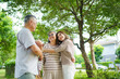 © DG PhotoStock - Asian family living together in park showing love, relationship and bonding.