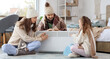 © Pixel-Shot - Frozen family warming near electric convector heater in bedroom