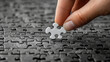 © AdolescentChat - A close-up of a businessman holding a jigsaw puzzle, illustrating a business cooperation strategy concept.