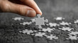 © AdolescentChat - A close-up of a businessman holding a jigsaw puzzle, illustrating a business cooperation strategy concept.