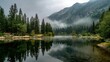 © Formoney - Calm waters mirror the serene landscape as early fog blankets the mountains and trees.