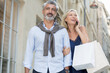 © auremar - portrait of mature couple with shopping bags outdoors