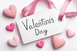 © Irina B - Valentine's day celebration concept with handwritten tag and pink hearts for holiday design on white background