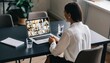 © Rifqi - Young woman attends virtual meeting on laptop with multiple participants from home office, concept for remote work, online education and video conferencing