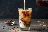 Iced Coffee with Milk Pouring into a Glass 