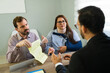 © AntonioDiaz - Injured couple discussing insurance claim with lawyer